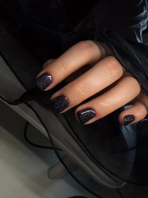 Dark glitter galaxy nails with holographic shimmer — luxury nails Utrecht